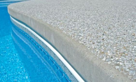 A newly remodeled commercial pool in Pasadena featuring custom coping, waterline tiles, and eco-friendly design elements.
