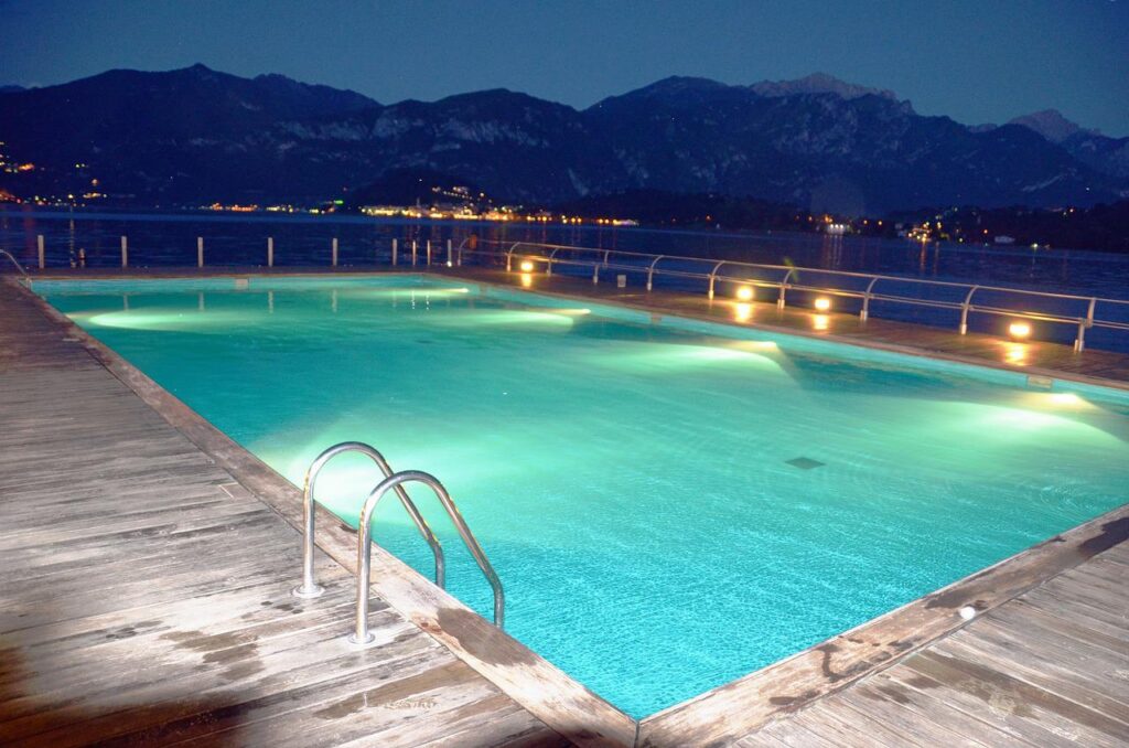 A pool lit up at night 