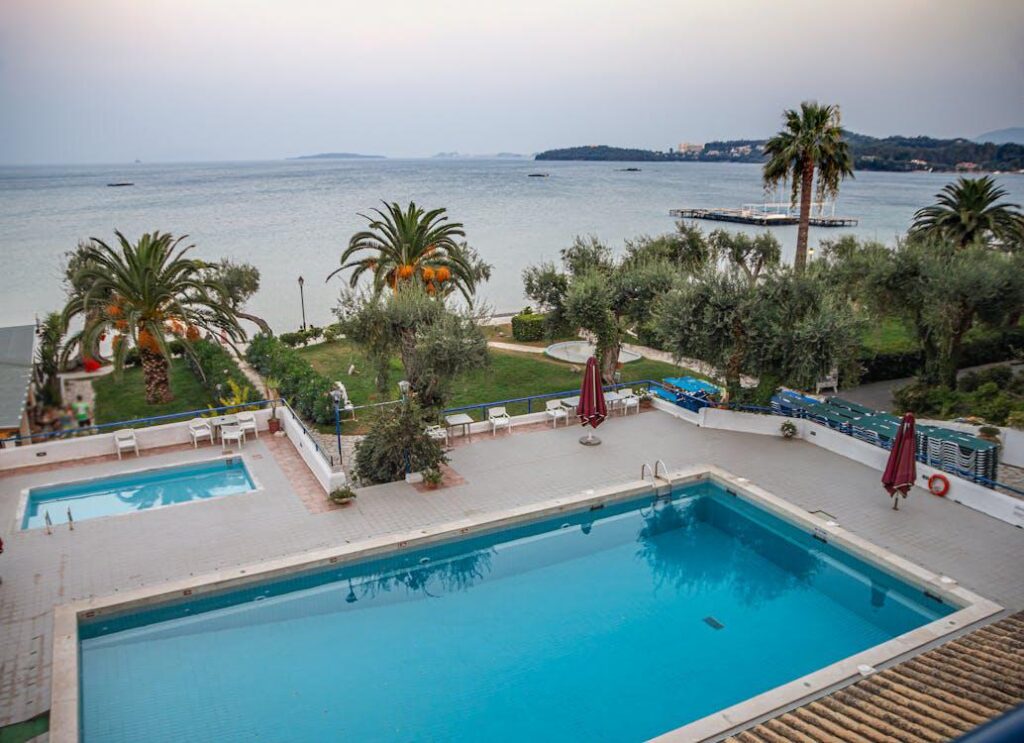 A hotel with an adults’ and a children’s swimming pool