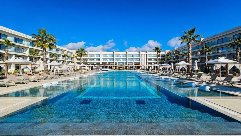 A hotel with a large swimming pool