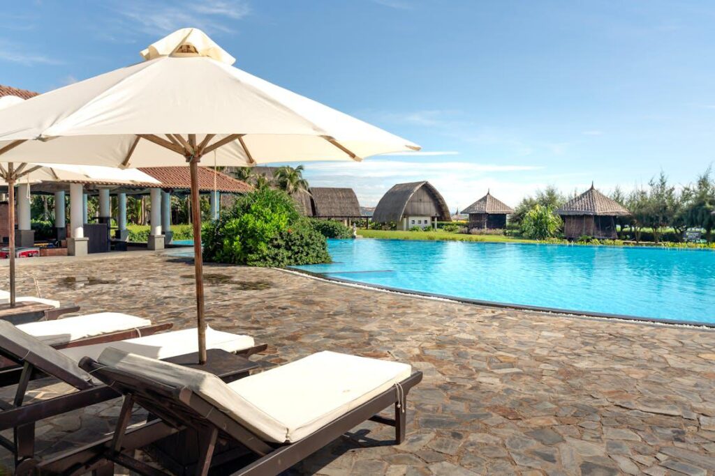 A swimming pool with sun loungers