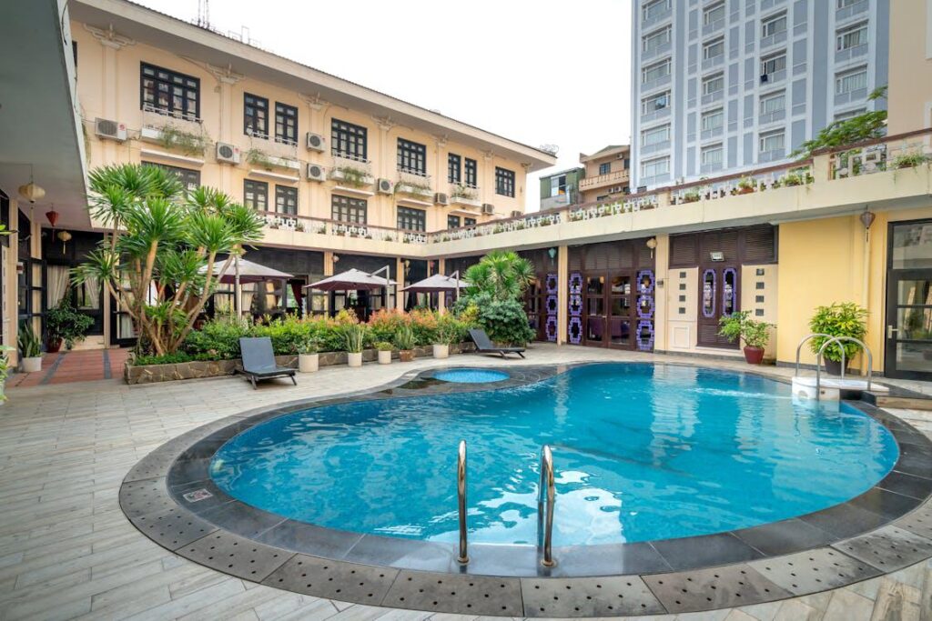 A small-sized hotel with a modern swimming pool