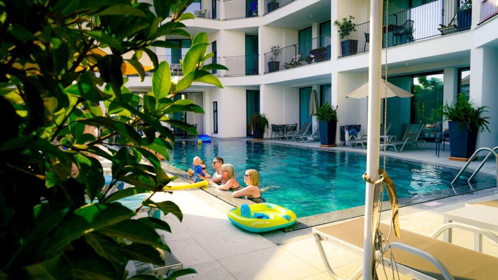 People enjoying a hotel swimming pool