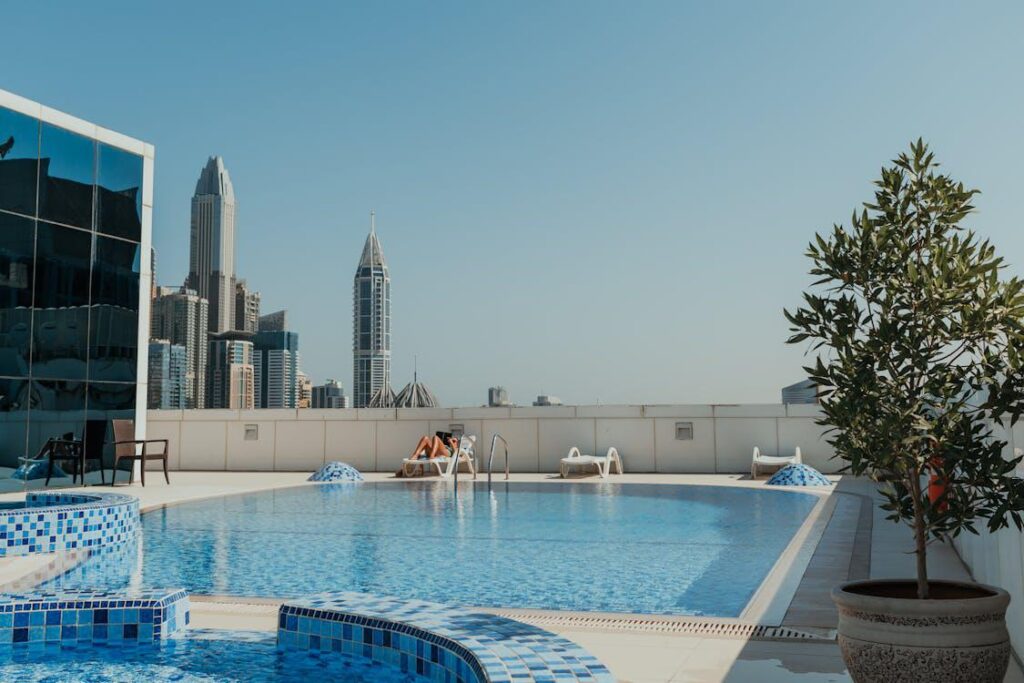 A commercial swimming pool with a city scape view