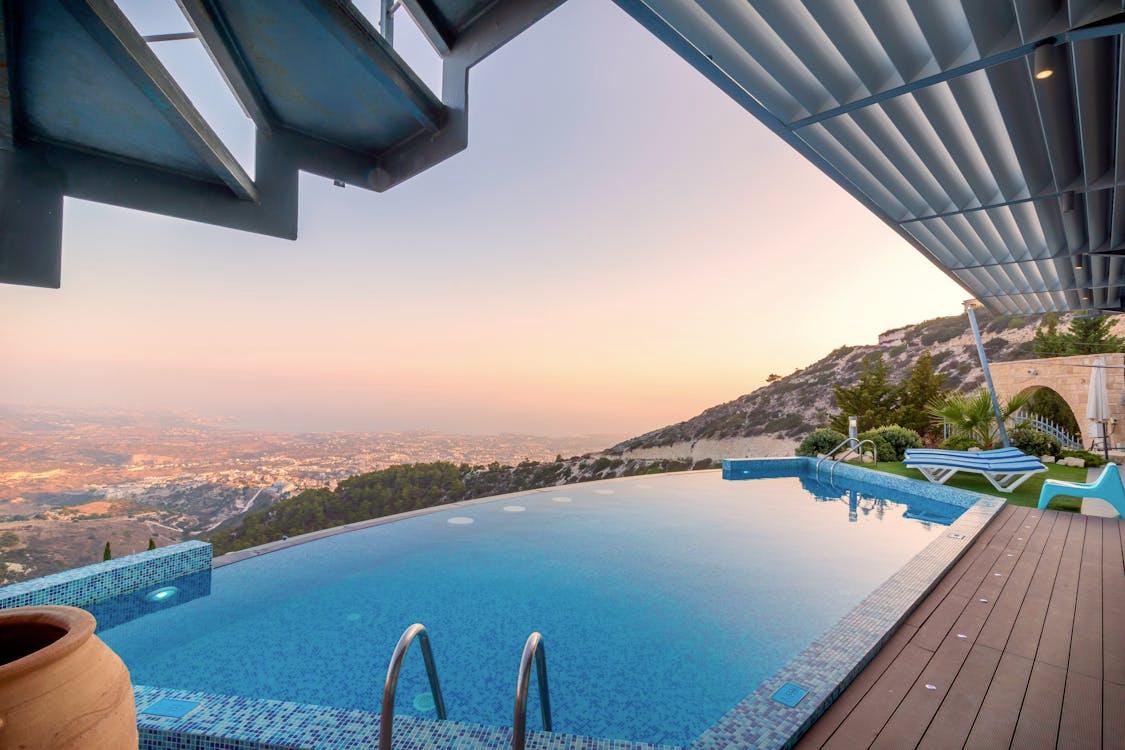 A sleek infinity pool design overlooking a scenic landscape