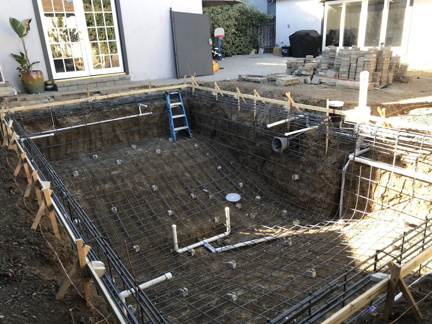 A newly remodeled commercial pool in Pasadena featuring custom coping, waterline tiles, and eco-friendly design elements.