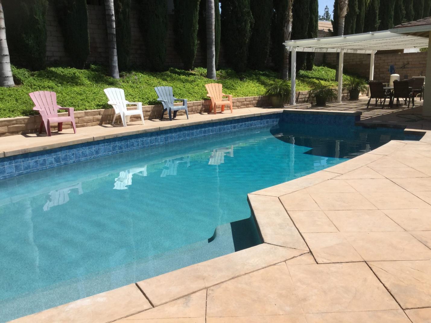 A picture of a swimming pool with new tiles
